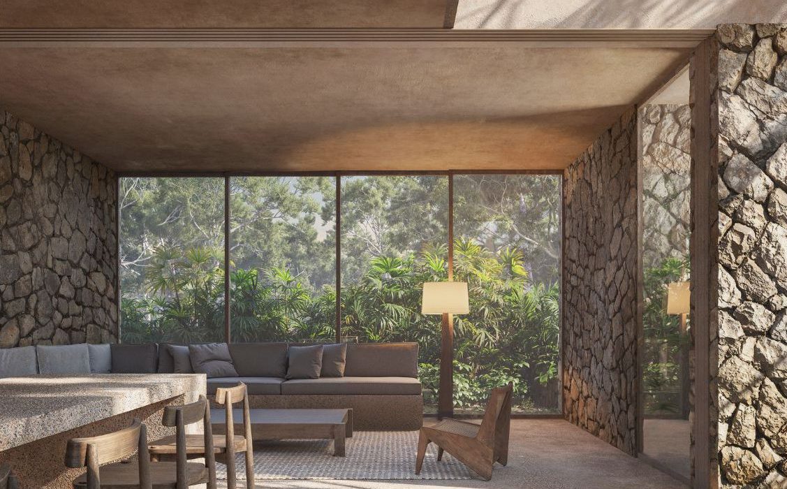 Bespoke living room featuring an indoor-outdoor flow, typical of the best Tulum luxury homes for sale.